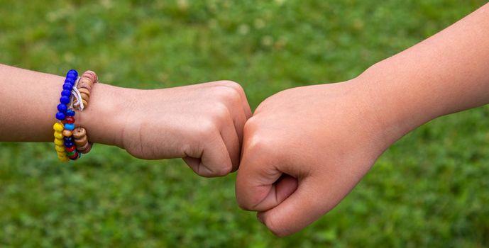 The children put their hands together. Selective focus. kids