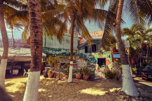 Playa del carmen, Mexico 20 august 2022: Small cottage on the beach of Playa del Carmen in Mexico surrounded by palm trees and local vegetation.