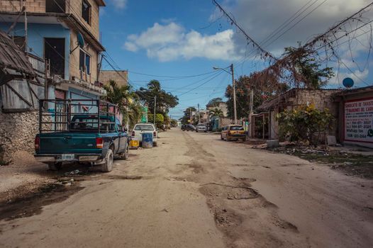 Tulum, Mexico 20 august 2022: View of the center of a dirt road of Tulum in Mexico: A scene of the daily life of this small town of the Mayan Riviera