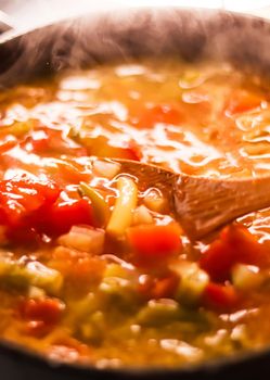 Cooking vegetable soup in saucepan, comfort food and homemade meal concept