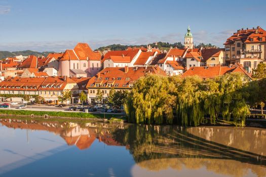 Lent district in Maribor, Slovenia. Popular waterfront promenade with historical buildings and the oldest grape vine in Europe