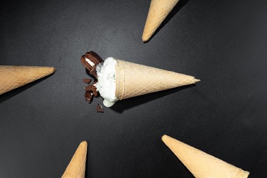 Homemade Cookies and cream cone ice cream, dark background photo with flash. Flashy food Ice cream.