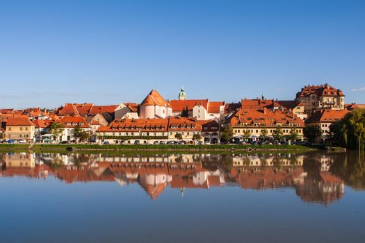 Lent district in Maribor, Slovenia. Popular waterfront promenade with historical buildings and the oldest grape vine in Europe