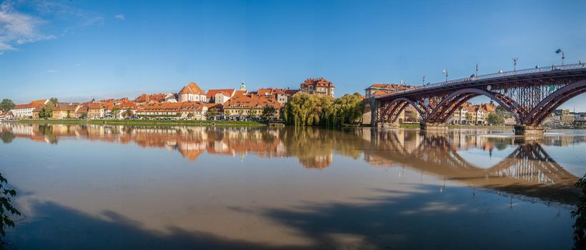 Lent district in Maribor, Slovenia. Popular waterfront promenade with historical buildings and the oldest grape vine in Europe