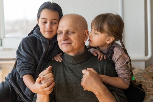 Family bonding. grandfather and child holding hands together, closeup view. Panorama.