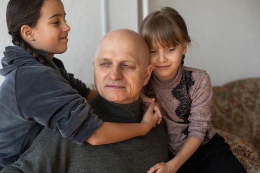 Family bonding. grandfather and child holding hands together, closeup view. Panorama.