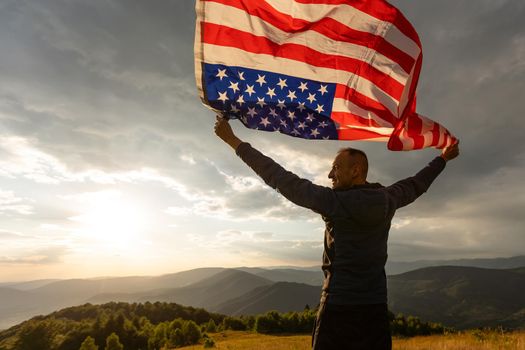 American Flag Celebration. Navy Soldier with United States of America Flag in Hands. Military Concept.