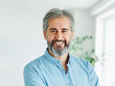 portrait of a senior busninessman smiling in the office