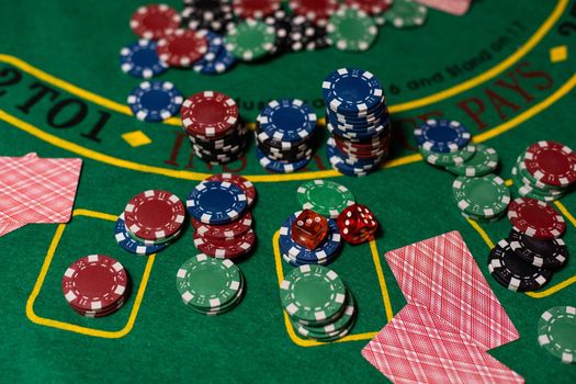 cards on a green cloth Casino table.