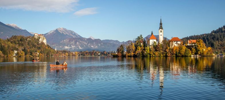 Panoramic view of Julian Alps, Lake Bled with St. Marys Church of the Assumption on the small island. Bled, Slovenia, Europe