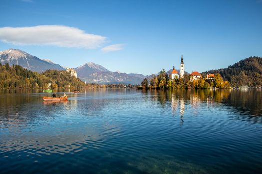 Panoramic view of Julian Alps, Lake Bled with St. Marys Church of the Assumption on the small island. Bled, Slovenia, Europe