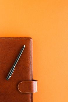 Modern workspace, productivity and corporate lifestyle concept - Luxury business brown brief-case on the office table desk, flatlay