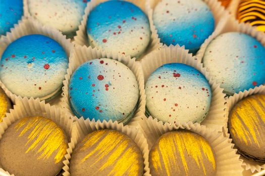 delicious cakes macaroni cookies. Multi-colored macaroni biscuits close-up in a box. Box of fresh colorful French macaroon pastry cookies.