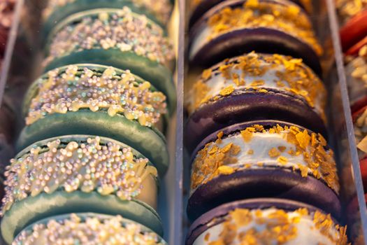 cakes with ice cream on the store counter , cafe showcase, dessert for coffee and tea. Cake displayed in shop window of cafe. Blurred background, selective focus, nobody.