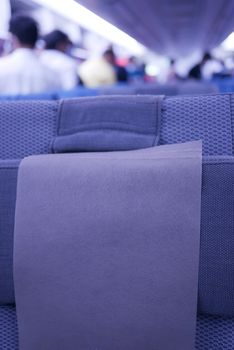 purple color Empty passenger airplane seats in the cabin,
