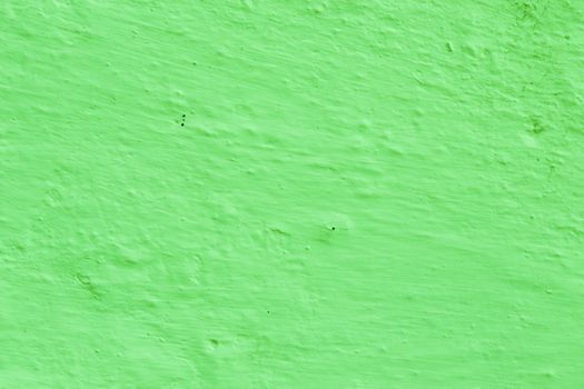 The surface of the old plaster of green bright color. Abstract background for design with copy space.