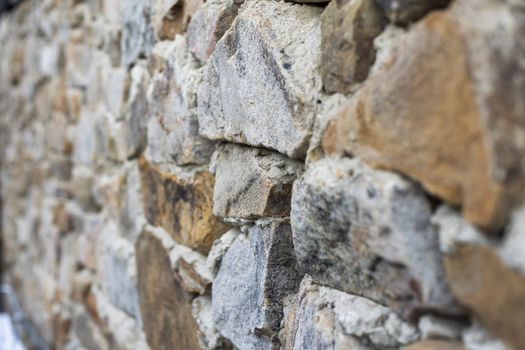 Texture of a stone wall. Old castle stone wall texture background. Stone wall as a background or texture. Part of a stone wall, for background or texture