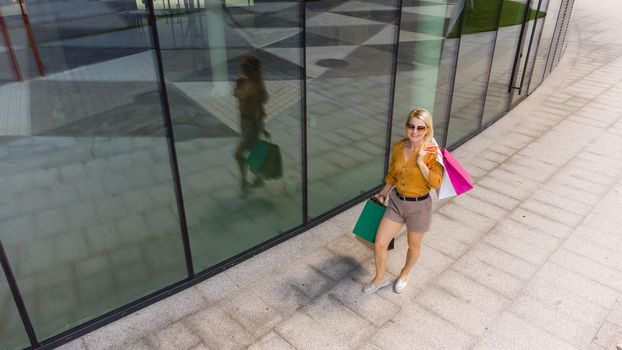 beautiful woman with many shopping bags.