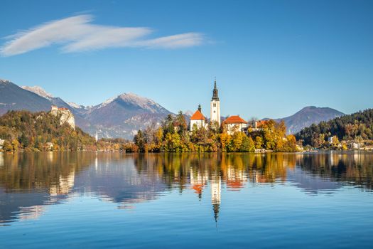 Panoramic view of Julian Alps, Lake Bled with St. Marys Church of the Assumption on the small island. Bled, Slovenia, Europe