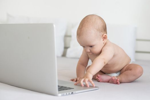 A baby and a computer