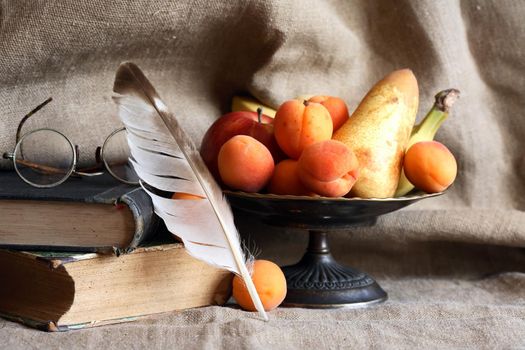 Heap of freshness fruits in  bowl againast nice gray canvas background