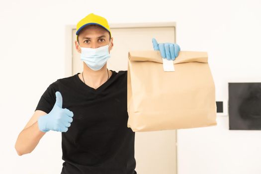 delivery man in protective gloves and a mask.