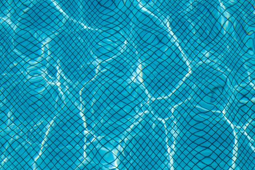 Hotel swimming pool with sunny reflections