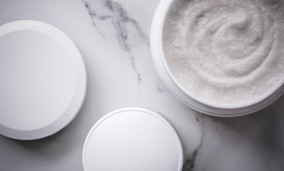 Skincare and body care, luxury spa and clean cosmetic concept. Health and beauty of your skin - Scrub and exfoliating cream products on a marble, flatlay