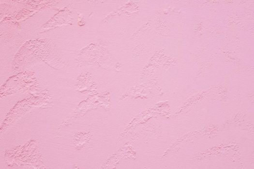 Texture of plastered wall. Textured pink color handmade surface for background. Color of the year 2019 - living coral.