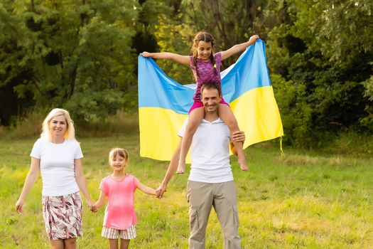 Ukraine's Independence Flag Day. Constitution day. family with the flag of ukraine in field. 24 August. Patriotic holiday