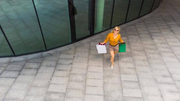 beautiful woman with many shopping bags.