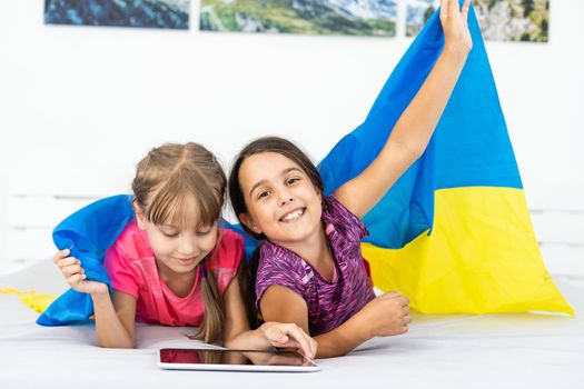 two little girls with the flag of ukraine