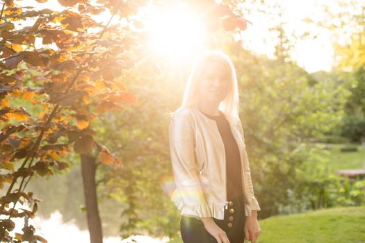 Thoughtful woman alone outdoors in an urban park.