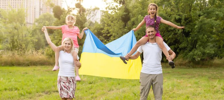 happy family with flag of ukraine in field. lifestyle.
