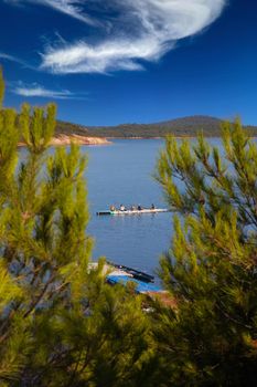 rowing team paddles on the tranquil sea. High quality photo