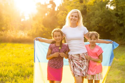 family with the flag of ukraine. Happy Independence Day of Ukraine. National Flag Day. Love for the homeland and symbols. Copy space