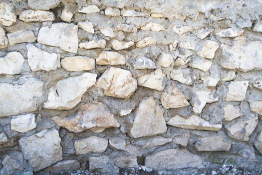 Texture of old stone. Old wall with a crack.Grunge background in dark color.