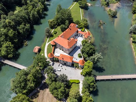 Romantic Otocec Castle on Krka River in Slovenia. Drone View