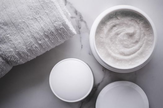 Skincare and body care, luxury spa and clean cosmetic concept. Health and beauty of your skin - Scrub and exfoliating cream products on a marble, flatlay