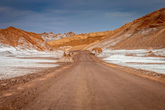 Country road in Atacama desert, moon valley arid landscape in Northern Chile, South America