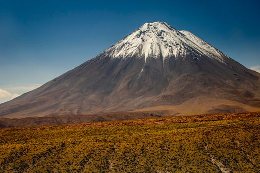 Licancabur volcano at sunny day, San Pedro de Atacama, Desert arid landscape, Chile, South America