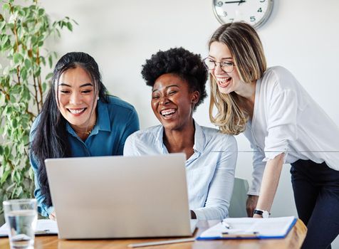 Portrait of a group of youn happy people in a start up office