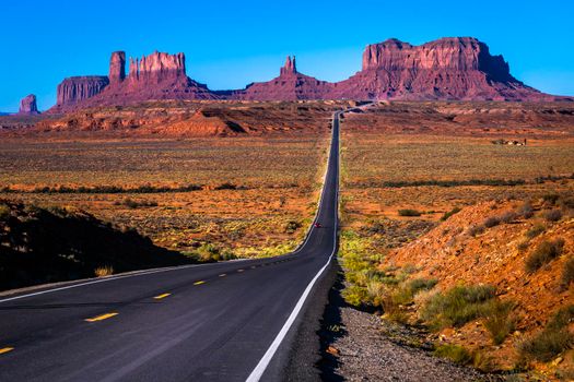 Highway Road U.S. Highway 163 and Monument Valley at sunset, Arizona, United States