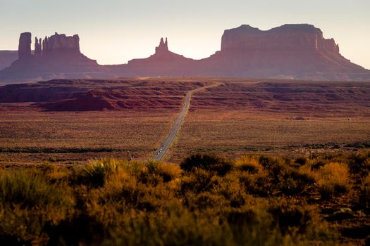 Highway Road U.S. Highway 163 and Monument Valley at sunset, Arizona, United States