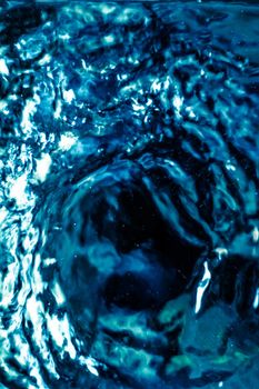 Abstract blue liquid surface as background - futuristic design and science concept. Deep blue waters