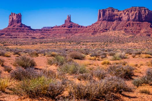 The Mittens, three buttes in Monument Valley at sunrise, Arizona and Utah, United States