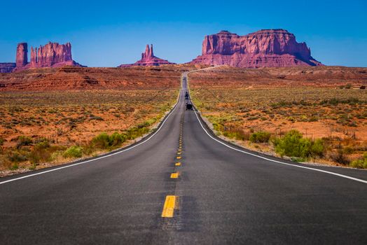 Highway Road U.S. Highway 163 and Monument Valley at sunset, Arizona, United States
