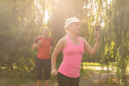 Running woman. Female Runner Jogging during Outdoor Workout in a Park
