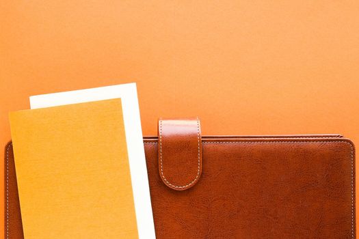 Modern workspace, productivity and corporate lifestyle concept - Luxury business brown brief-case on the office table desk, flatlay