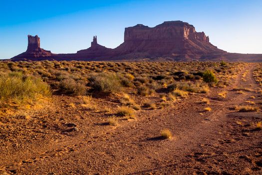 The Mittens, three buttes in Monument Valley at sunrise, Arizona and Utah, United States